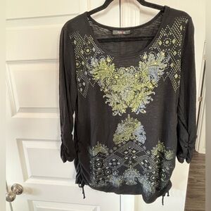 Large cotton black shirt with gold studs and gray emblem. Like new